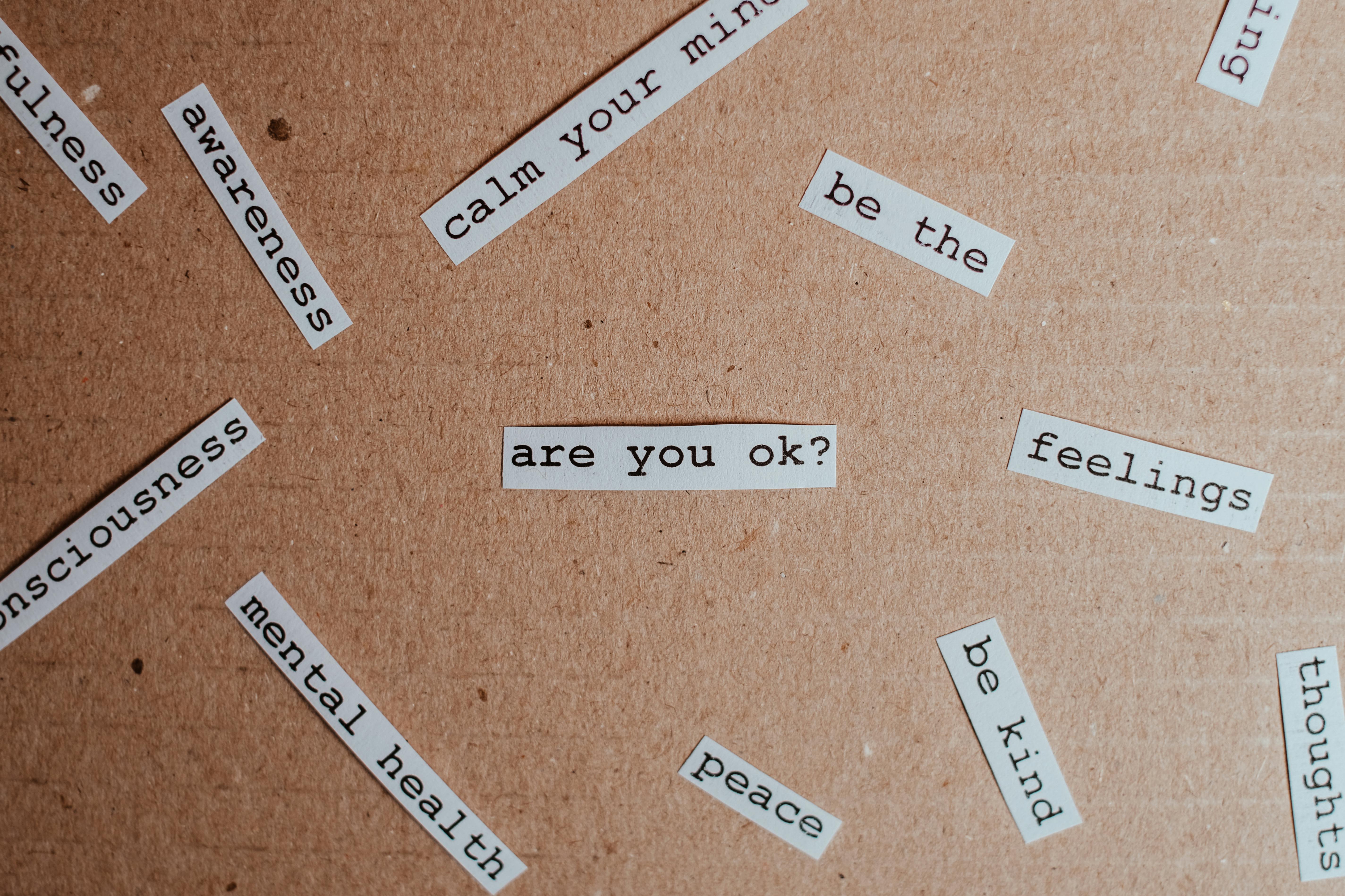 Brown surface with small pieces of paper with messages on them